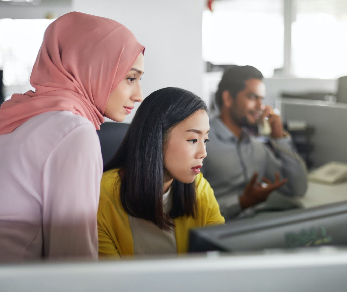 coworkers watching screen