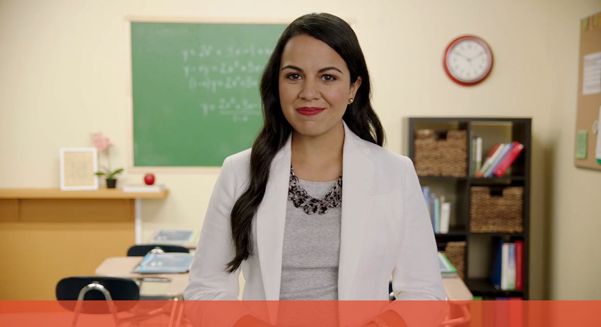 A woman standing in front of a classroom