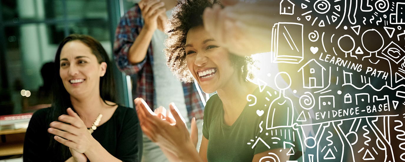 Three people smiling and clapping